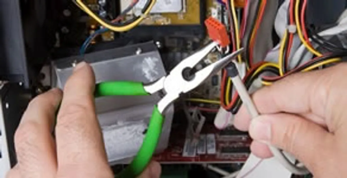 Licensed electrical contractor performing electrical repair with tools in Depew, NY